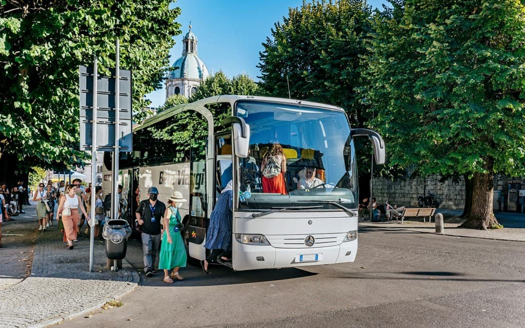 From Milan: Lake Como, Lugano & Bellagio by Bus with Private Boat Tour (Italian Guided Tour)