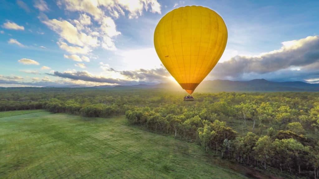 Sunrise Hot Air Balloon Flight near Cairns with Sparkling Wine and Optional Round Trip Transfer (Sunrise Hot Air Balloon Flight with Round Trip Transfer + Sparkling Wine + FREE Digital Photos and Bad Fishy Jet Boating Experience)